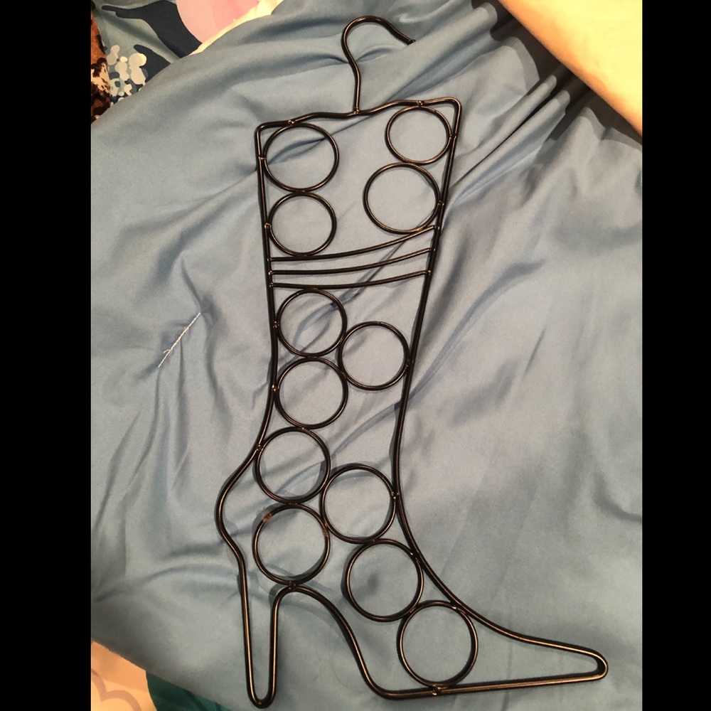 Boot shaped scarf hanger.